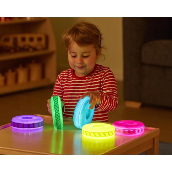 Glowing discs with wooden stand