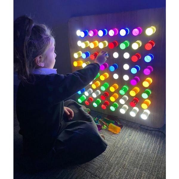 Wall hanging sensory light panel with coloured rods