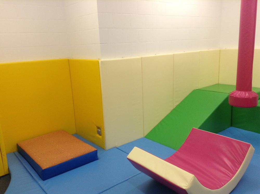 Softplay room with rainbow panels
